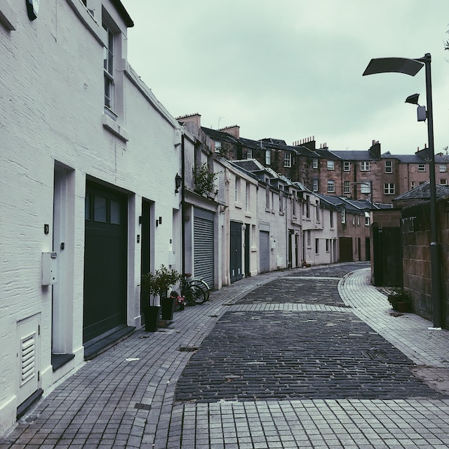 Glasgow cobblestone pavement next to homes